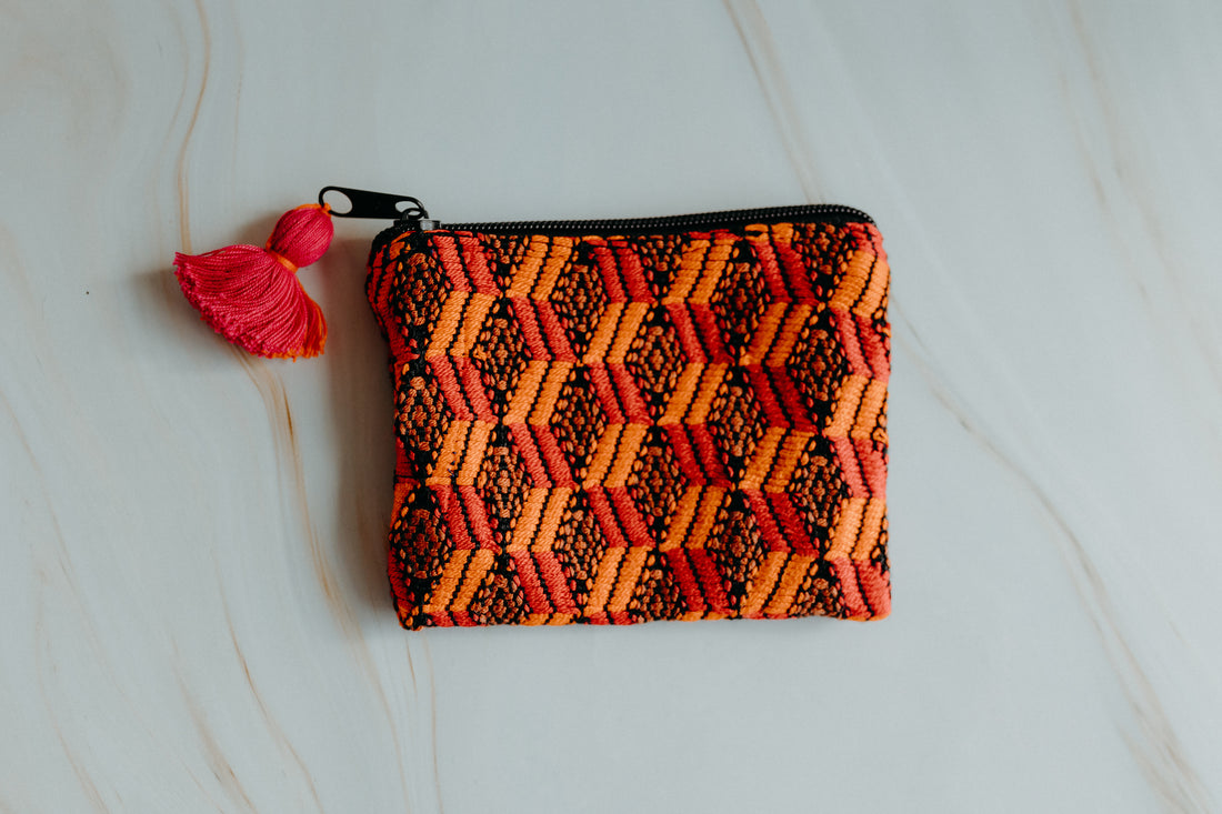 Handmade coin pouch bag, orange colour, featuring traditional upcycled textile