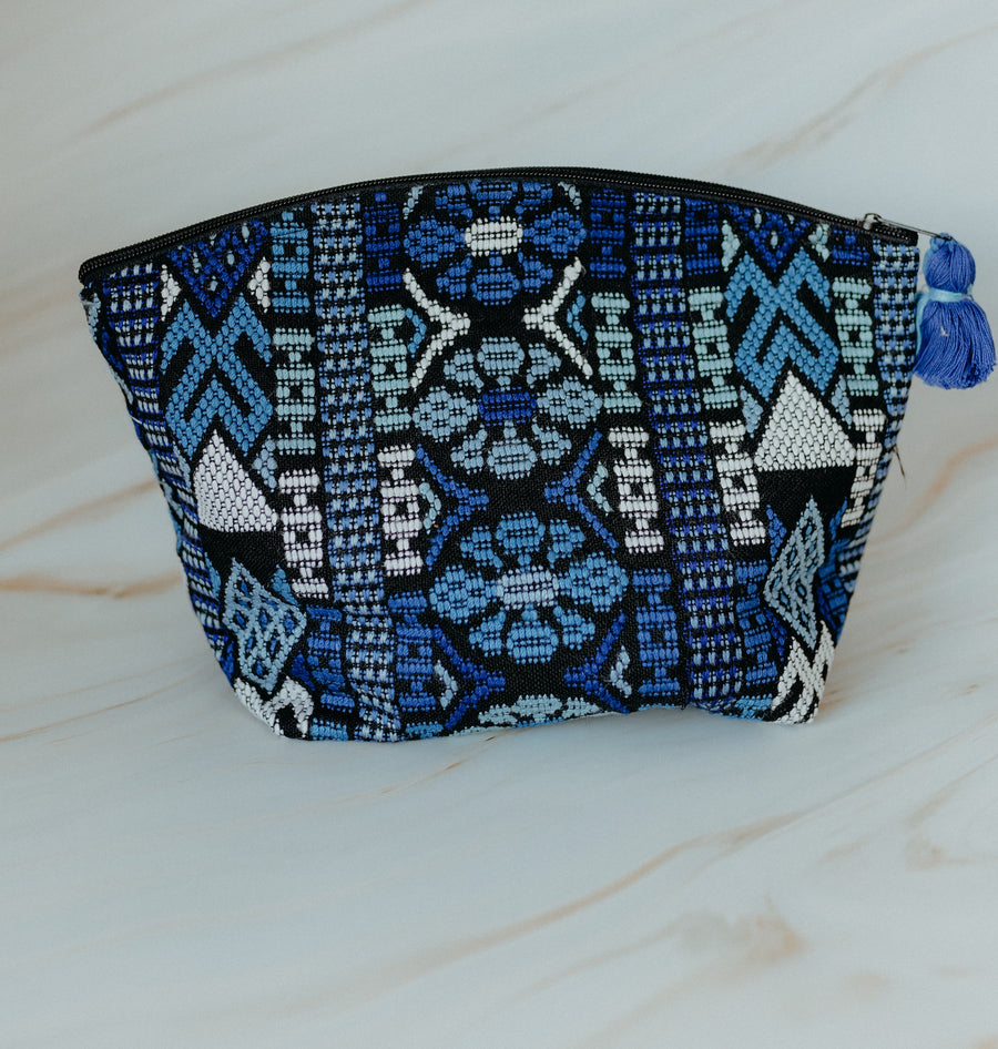 Blue handmade travel pouch bag featuring traditional indigenous patterns