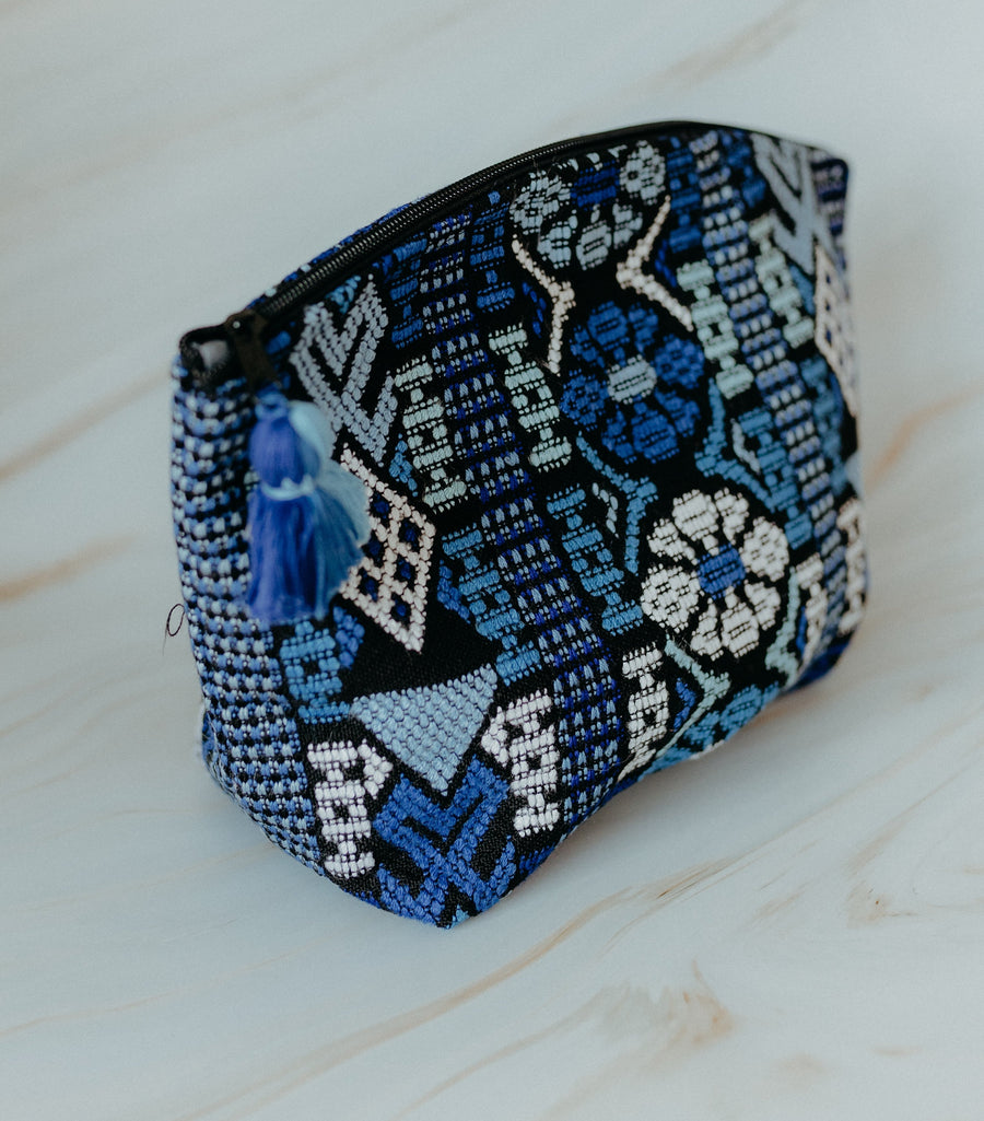 Blue handmade travel pouch bag with tassel detail
