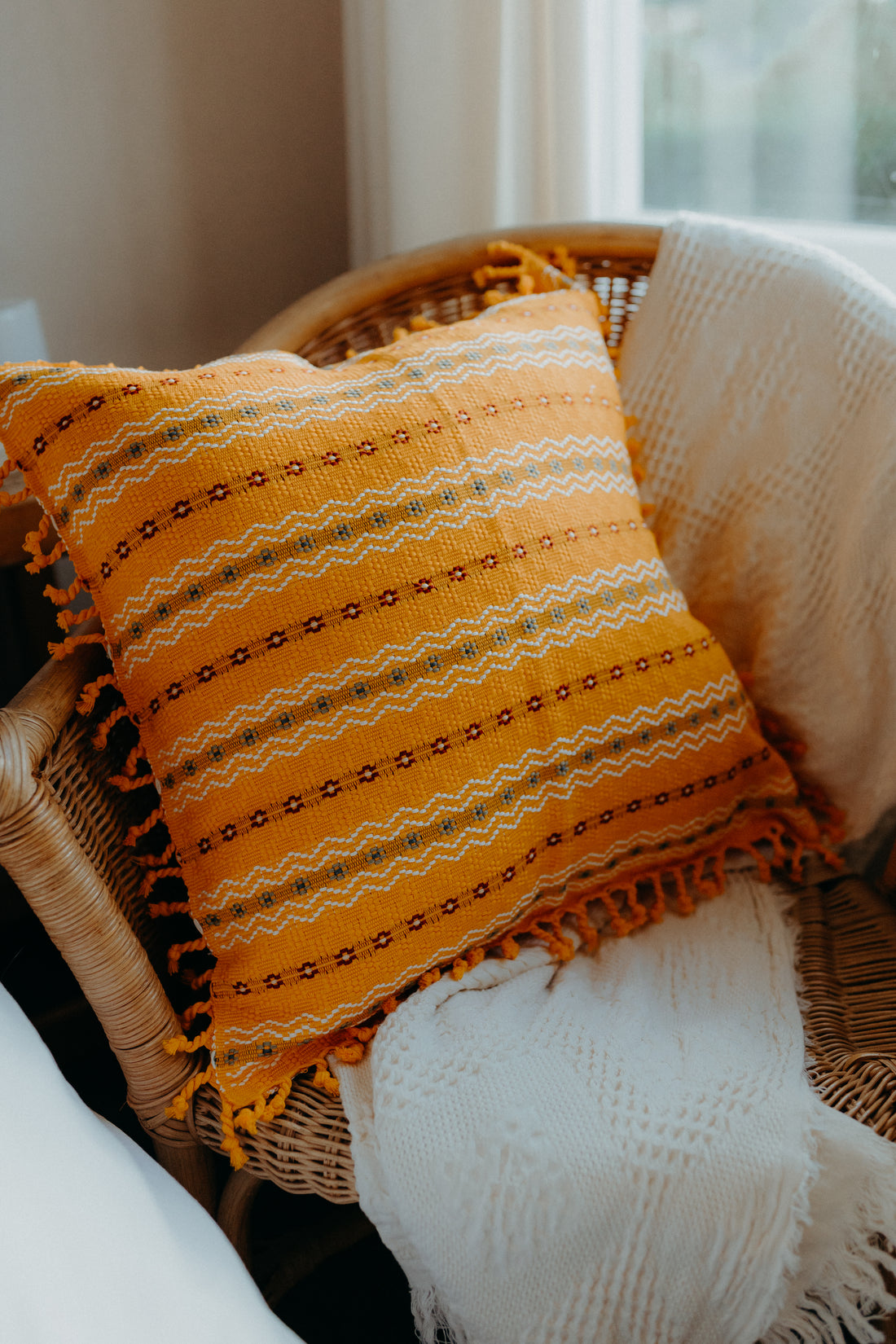 Yellow cushion cover on armchair 