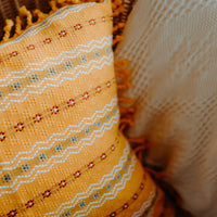 Yellow cushion cover close up