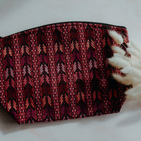 Pink handmade travel pouch bag with traditional indigenous design