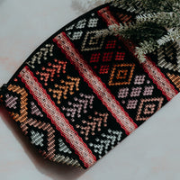 Colorful handmade travel pouch bag featuring traditional indigenous patterns