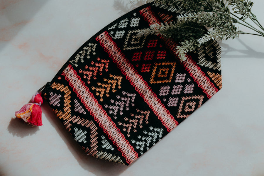 Colorful handmade travel pouch bag featuring traditional indigenous patterns